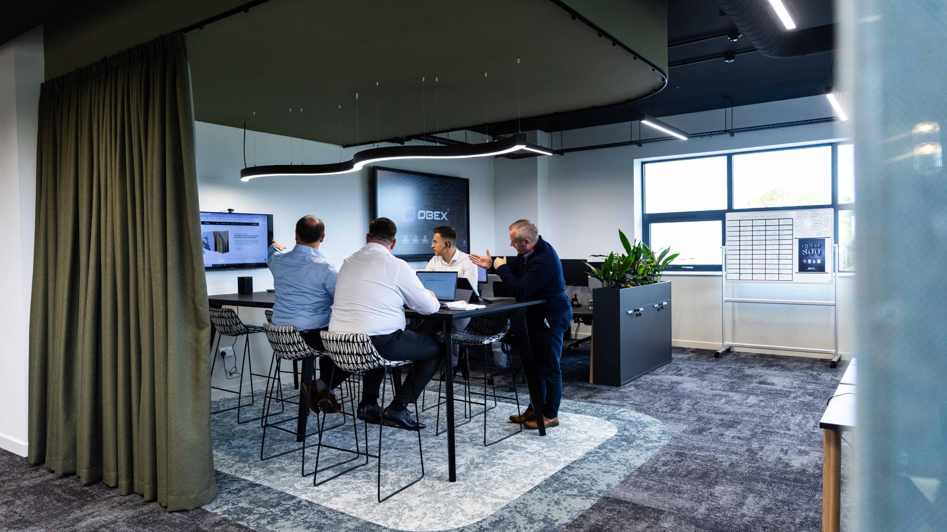 OBEX Protection employees having an informal meeting.